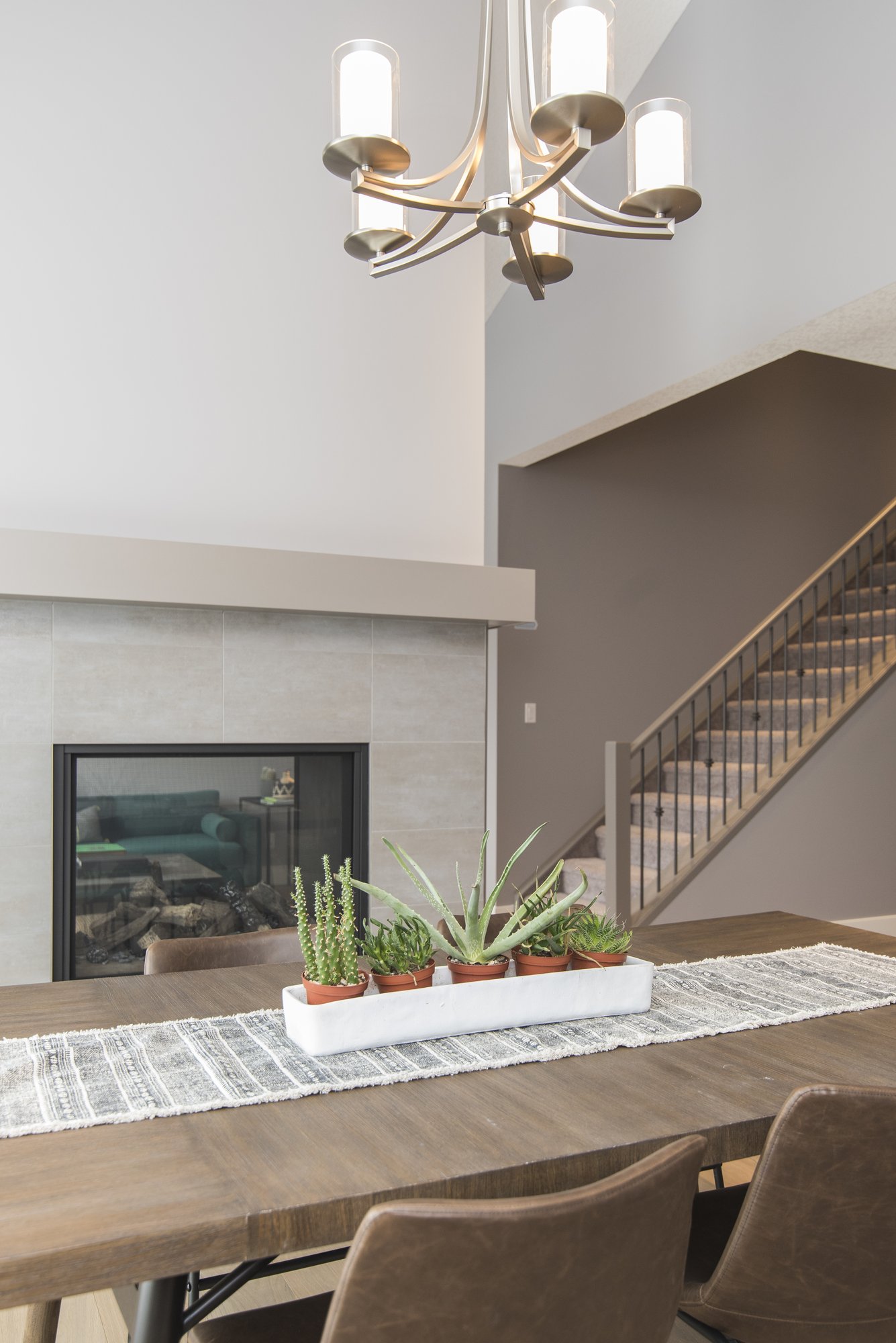 beautiful-shot-modern-house-dining-room-with-plants-fireplace