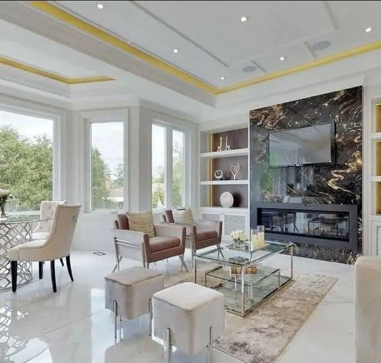 Finished living room with a full-height marble feature wall and linear fireplace